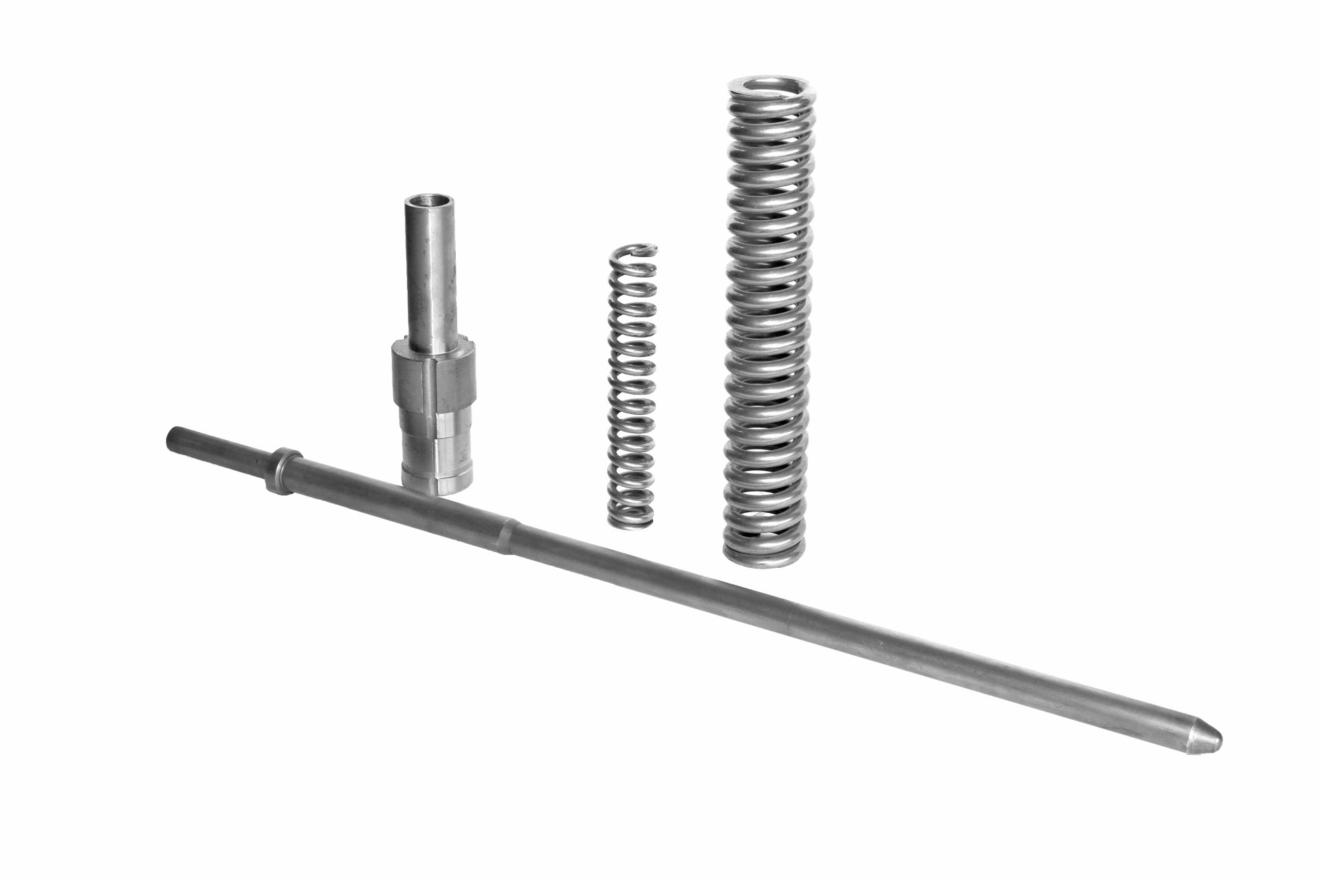 Four metal mechanical parts, including springs and a rod, arranged on a white surface.