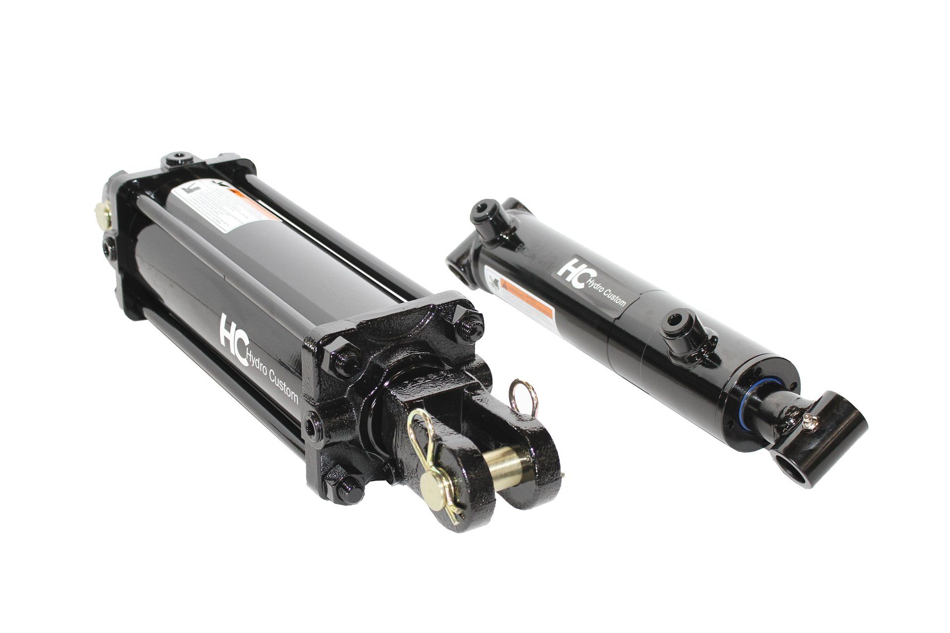 Two black hydraulic cylinders with mounting hardware.
