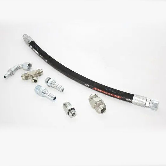 Hydraulic hose and fittings on a white surface.