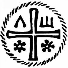 Black circular emblem with a cross dividing four symbols on a white background