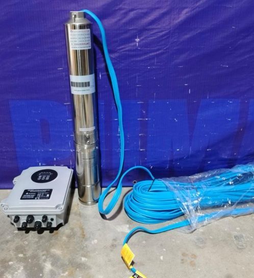 Stainless steel submersible pump with blue cable beside a control box on a blue tarp.
