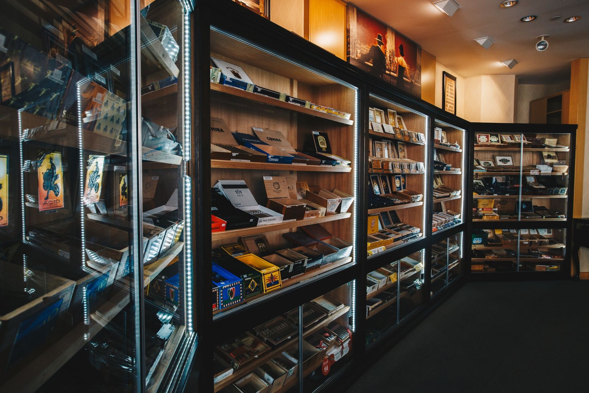 Glass display cases filled with assorted items in a warmly lit shop interior