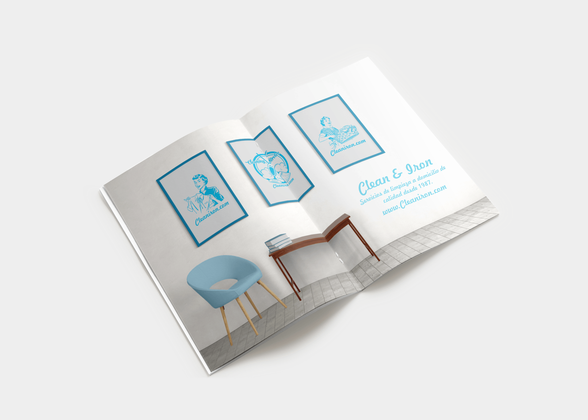 Un libro está abierto en una página con una imagen de una silla y una mesa. Mersi Studio