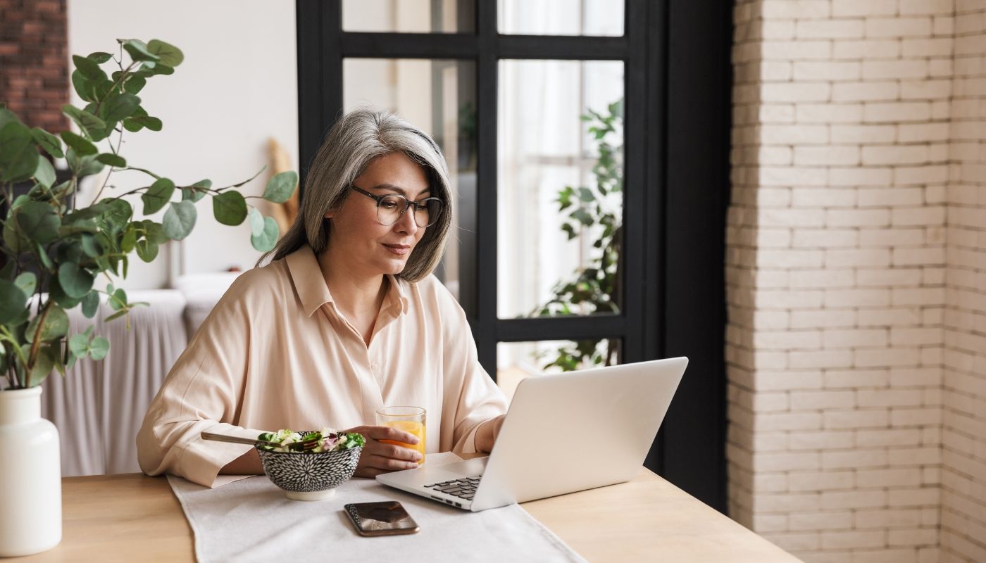 Image by Dean Drobot via Canva Middle-aged woman researching business ownership models