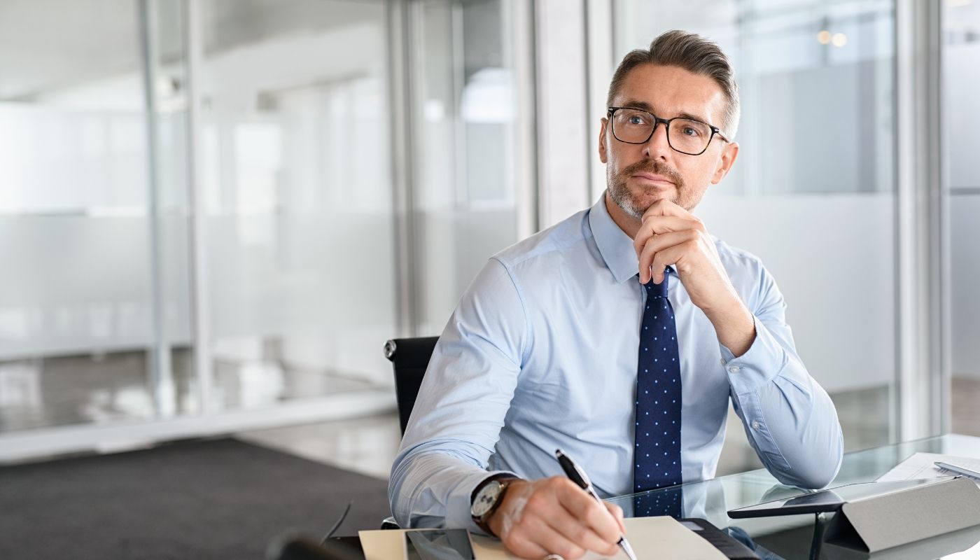 Business owner contemplating franchise business models
