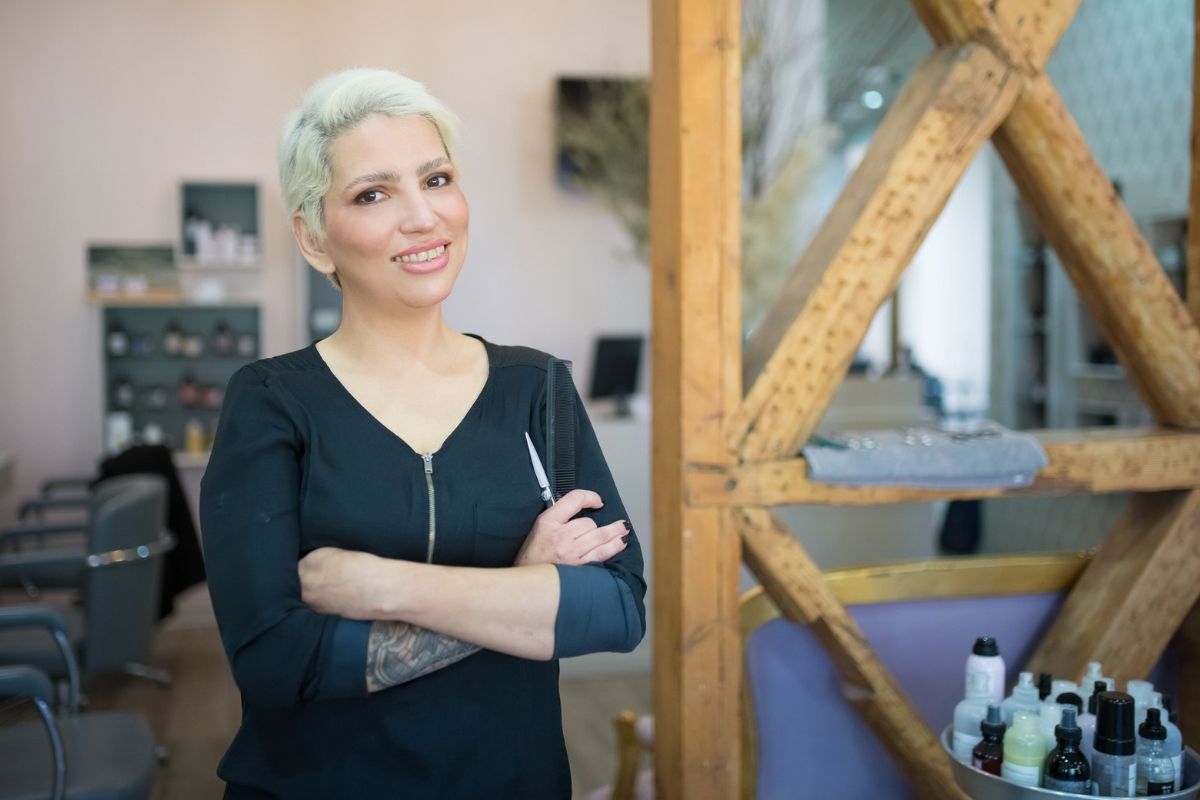 Successful salon owner, receiving the full advantages of owning a franchise