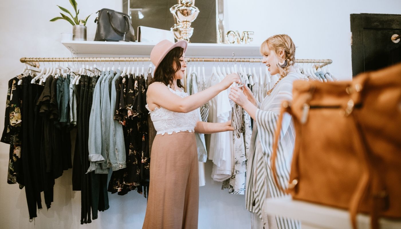 Boutique franchise owner attending to a customer