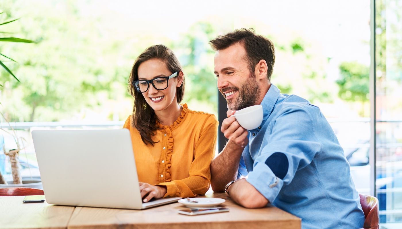 A couple asking questions before buying a franchise.