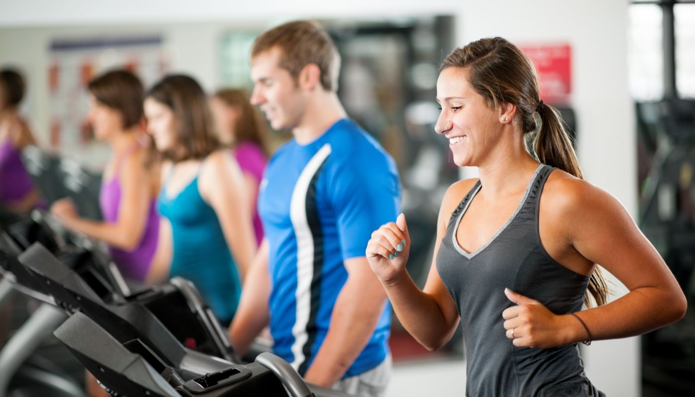 A group of people at a fitness gym franchise