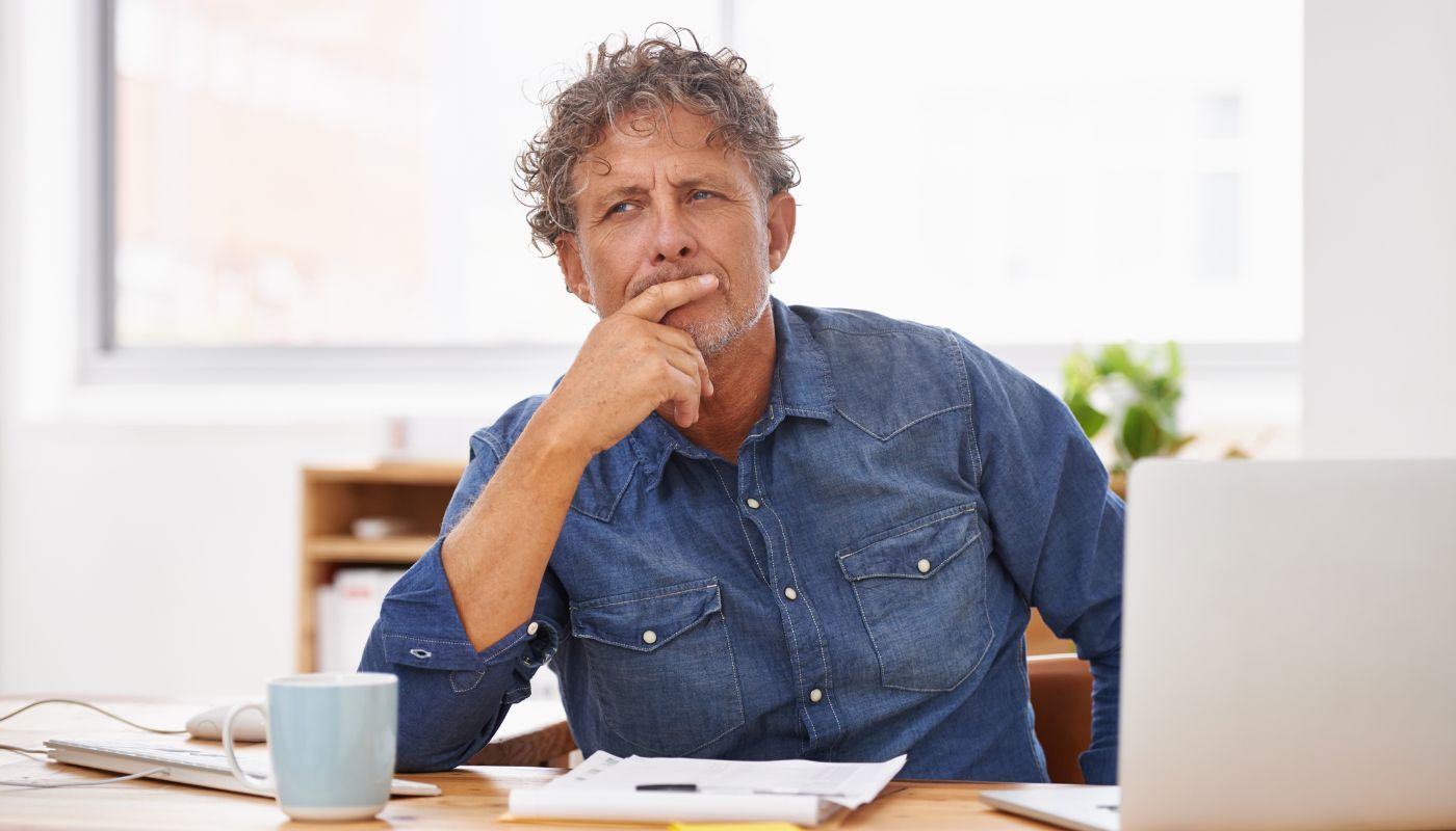 Adult male thinking about how to franchise a business