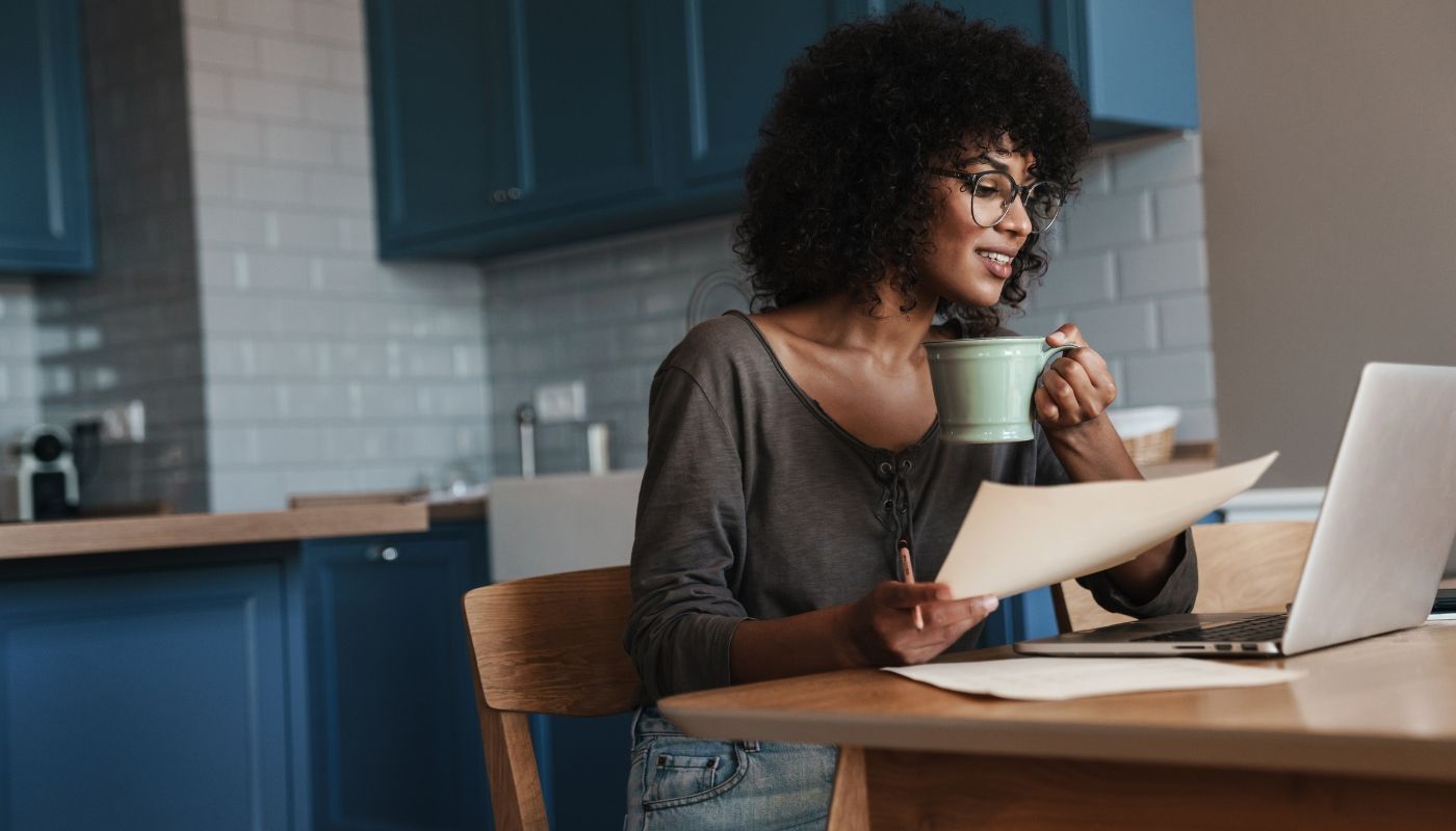 Female entrepreneur using laptop to research about franchise consulting service providers