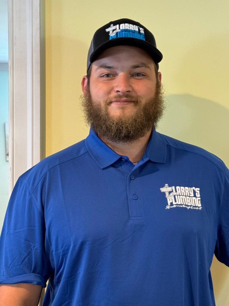 Man in blue polo and cap with