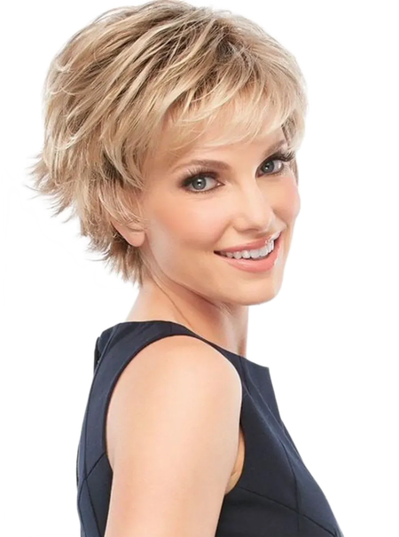 Smiling woman with short blonde hair in a dark sleeveless top, looking over her shoulder on a white background