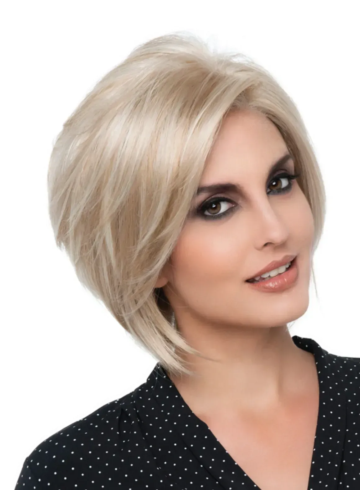 Portrait of a smiling person with short blonde hair against a white background