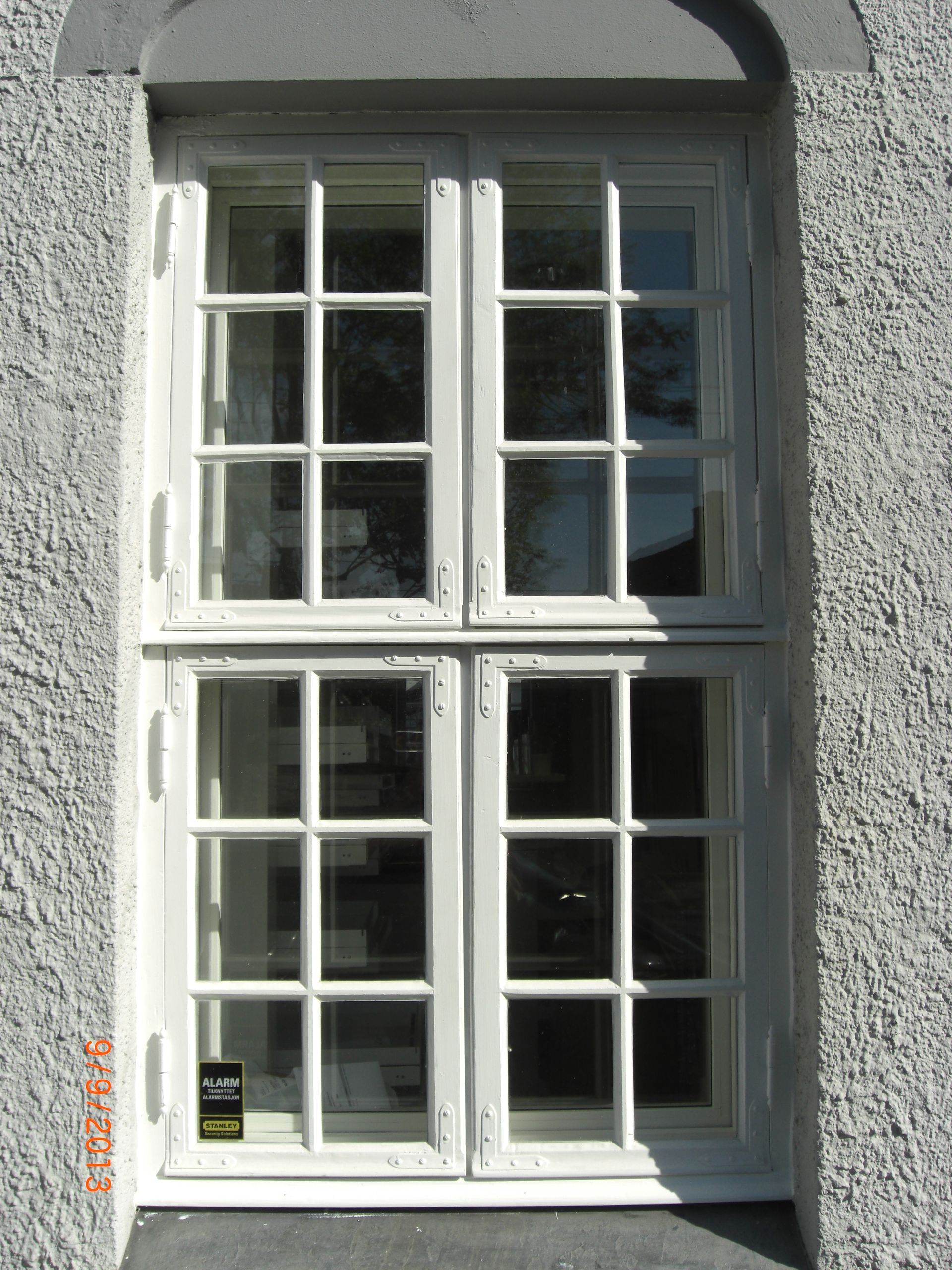 A white window with a black sticker on it