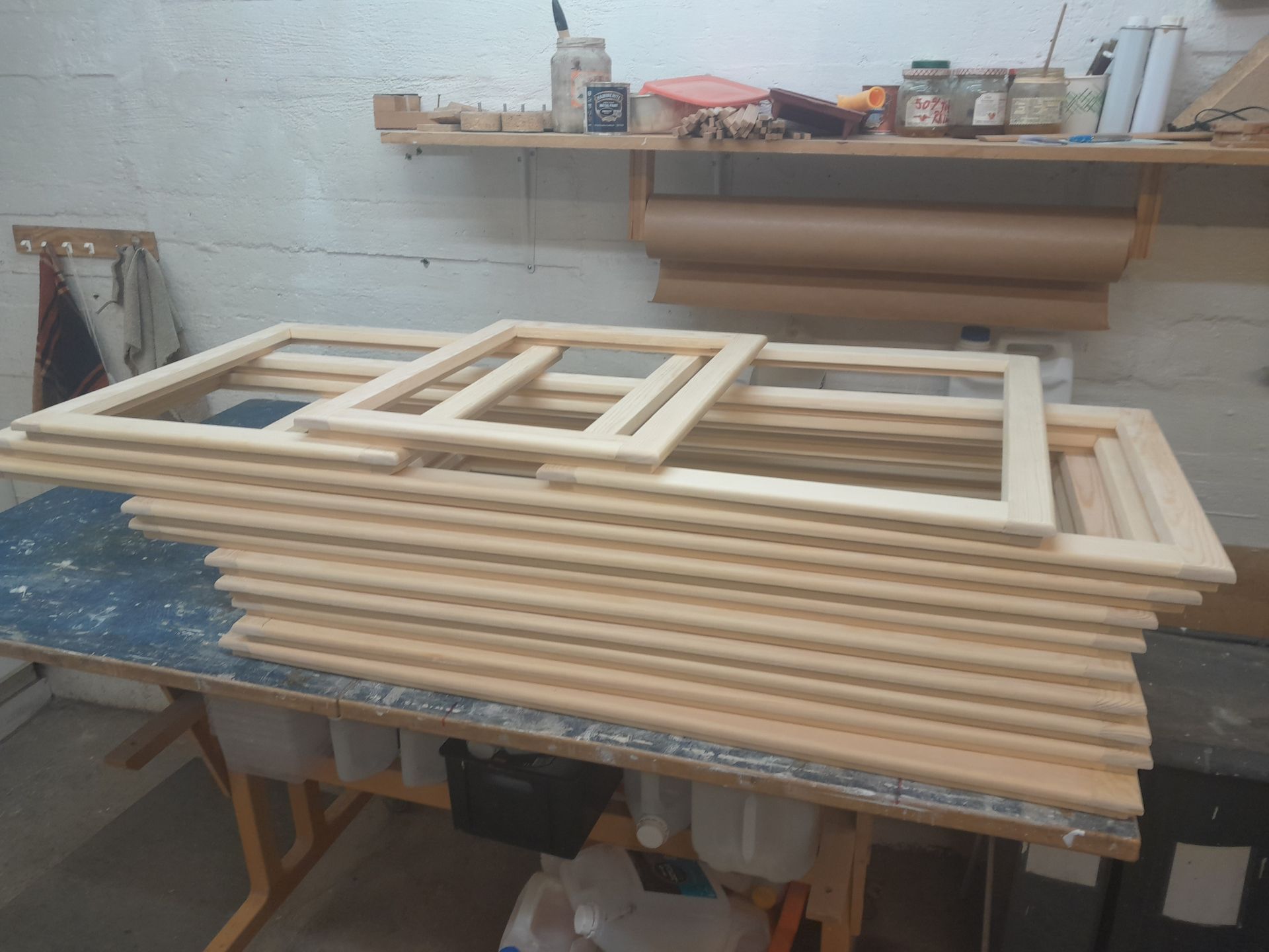 A bunch of wooden frames are stacked on top of each other