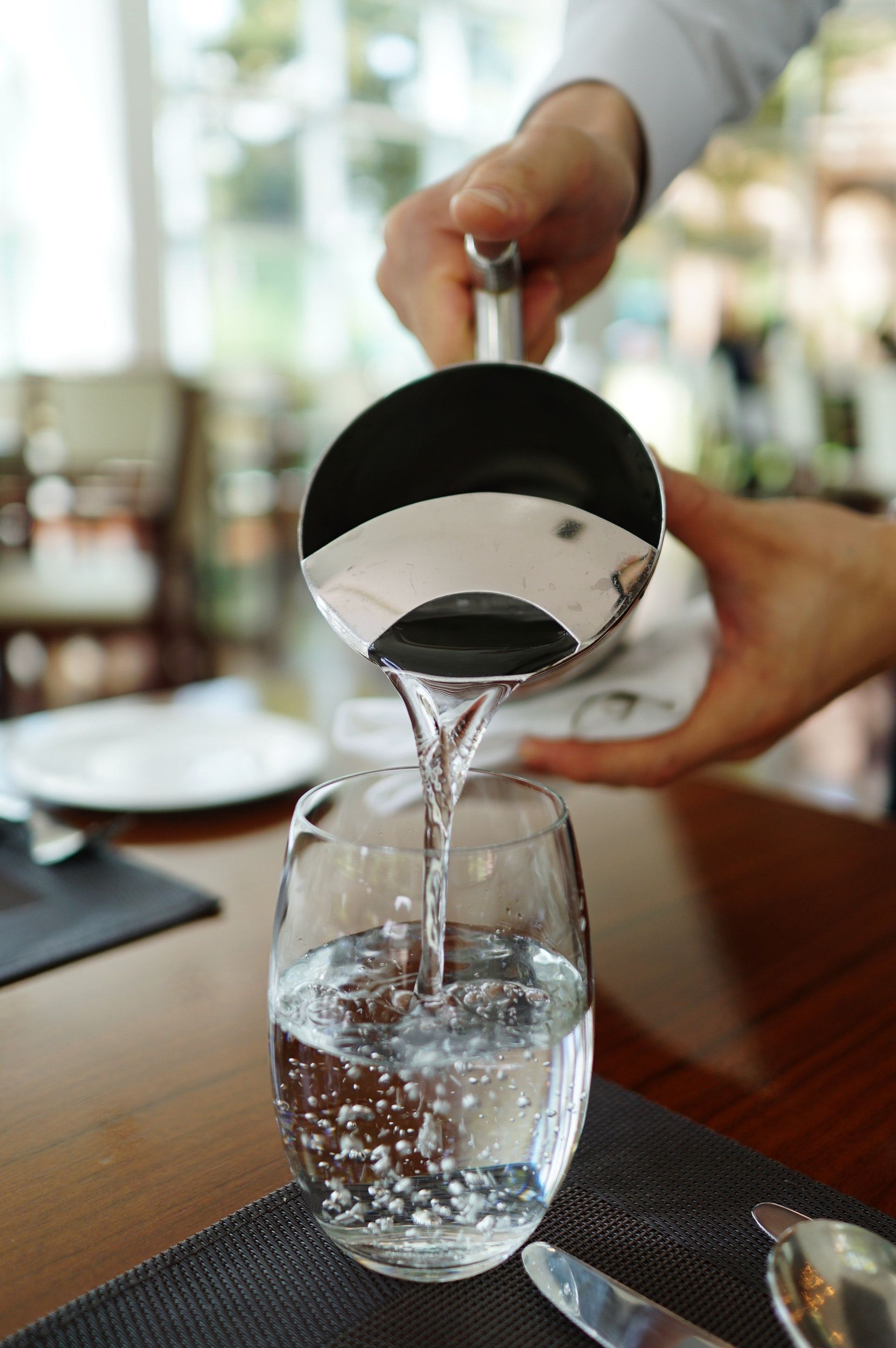 Pouring water to the glass