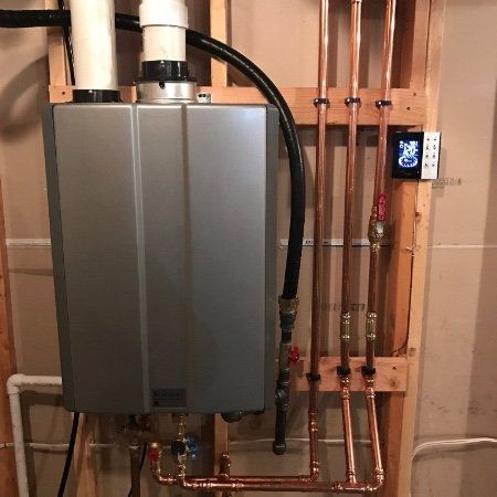 A water heater with a thermostat attached to it