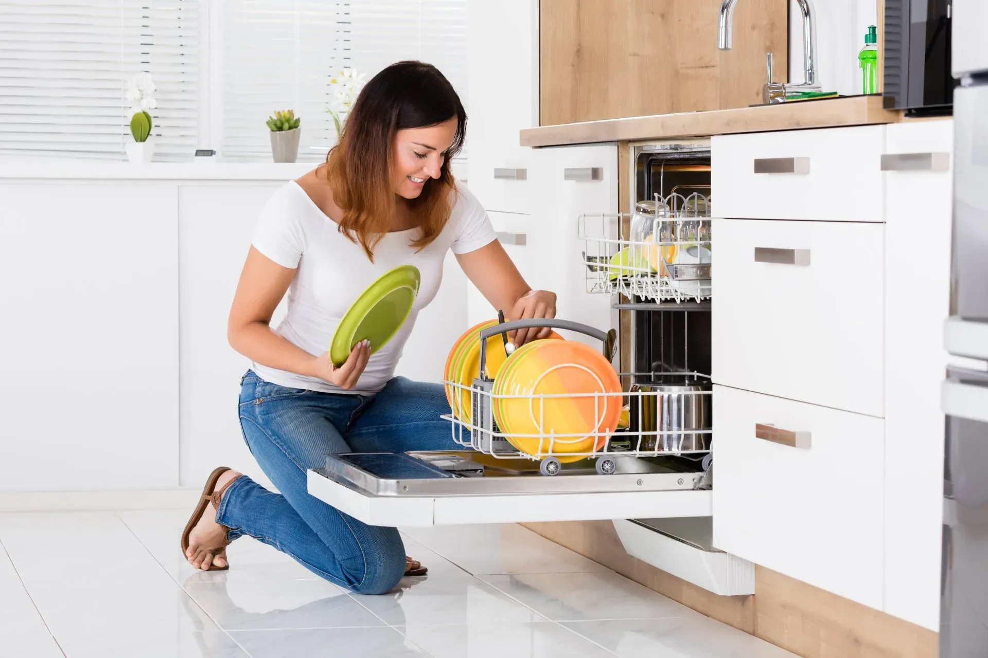 Image of lady doing dishes