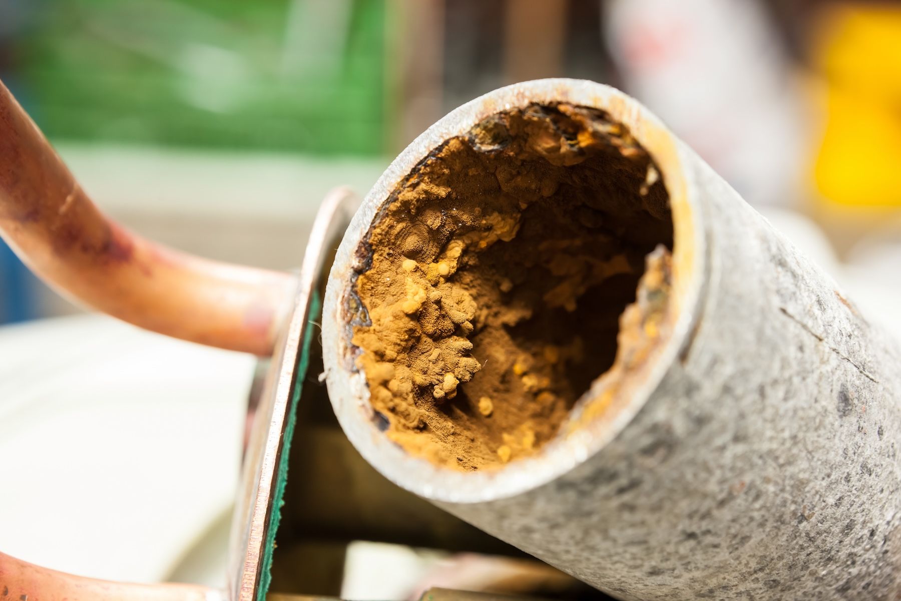 Hard water buildup on the inside of a pipe.