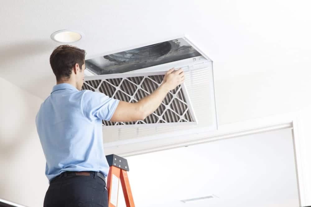 Picture of a technician preparing to do a duct cleaning.