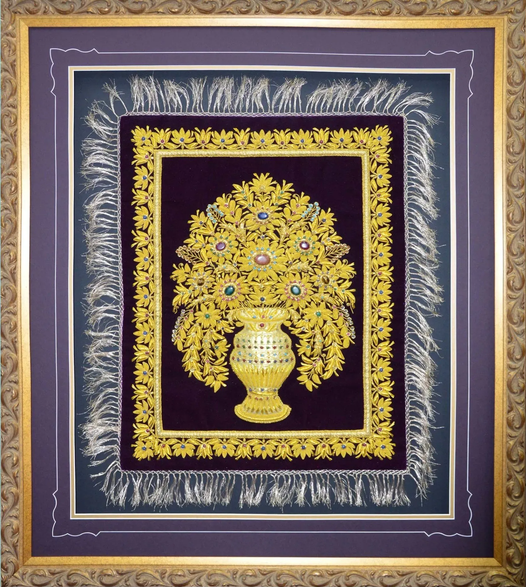 Framed gold floral arrangement artwork on a purple background