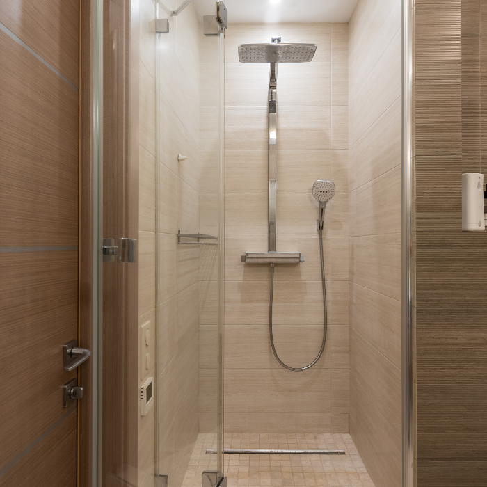 Large format tiles showing how shower tile size transforms a small bathroom into a spacious, modern space