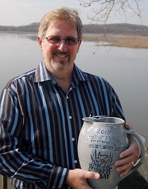 Person holding a jug 