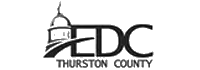 EDC Thurston County logo with stylized dome and swoosh in black on white background
