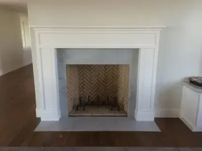 There is a fireplace in the middle of the room.
