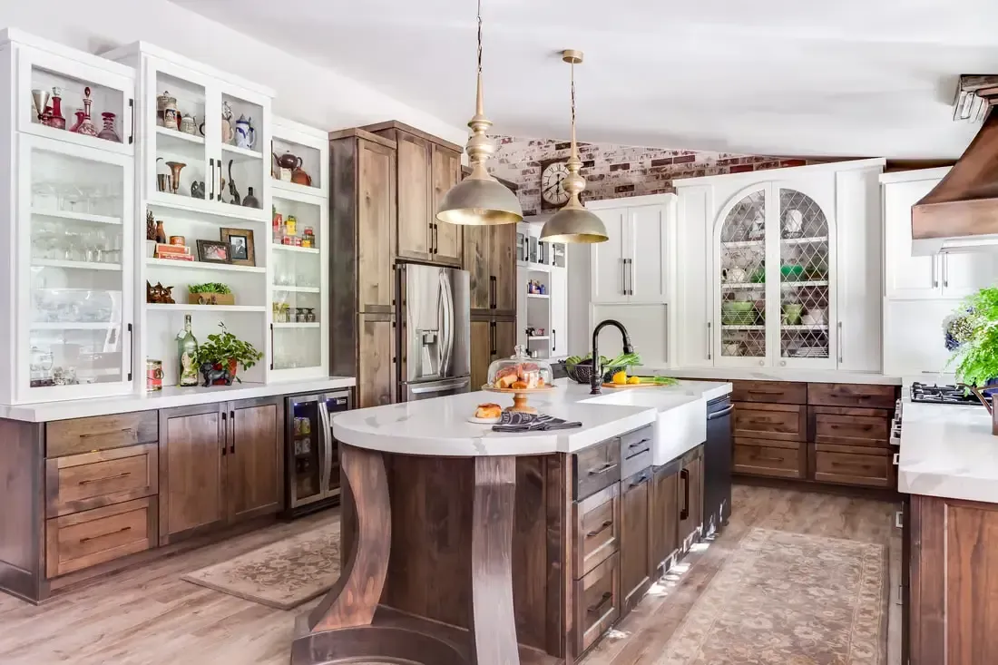 A kitchen with a large island in the middle of it.