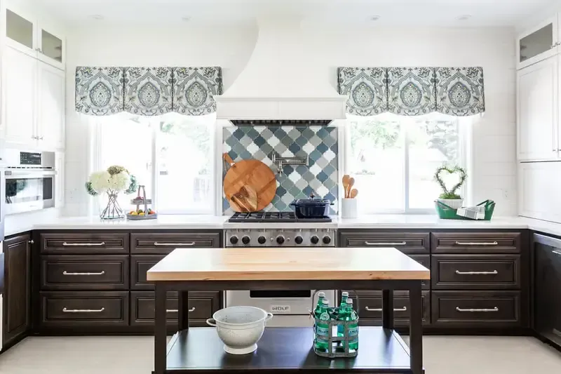 A kitchen with a large island in the middle of it.