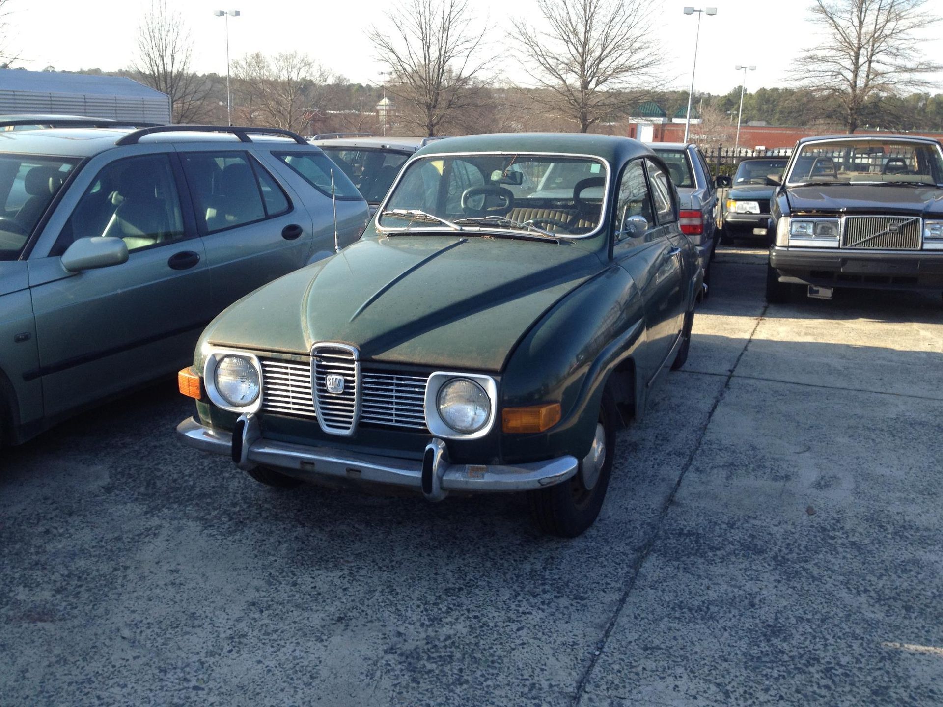 Green Saab Vehicle Parked Outside Automotive Service Center | Swedish Imports