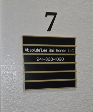 Court paperwork labeled “GUILTY PLEA” with U.S. $100 bills on top