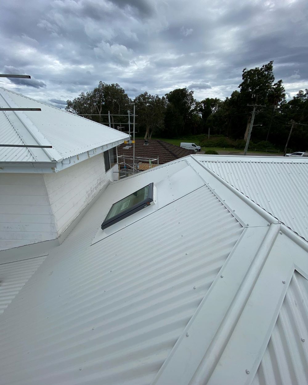 A White Roof With a Skylight on Top of It — Lake Valley Roofing in Kurri Kurri, NSW