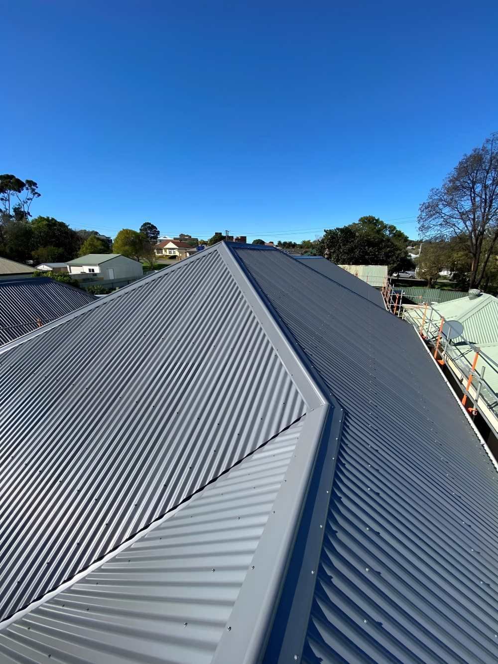 A Close Up of a Roof With a Blue Sky in the Background — Lake Valley Roofing in Redhead, NSW