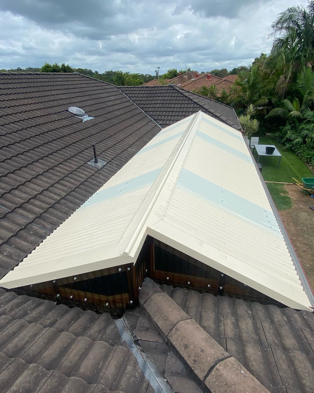 A Roof With a White Roof and a Window on It — Lake Valley Roofing in Weston, NSW