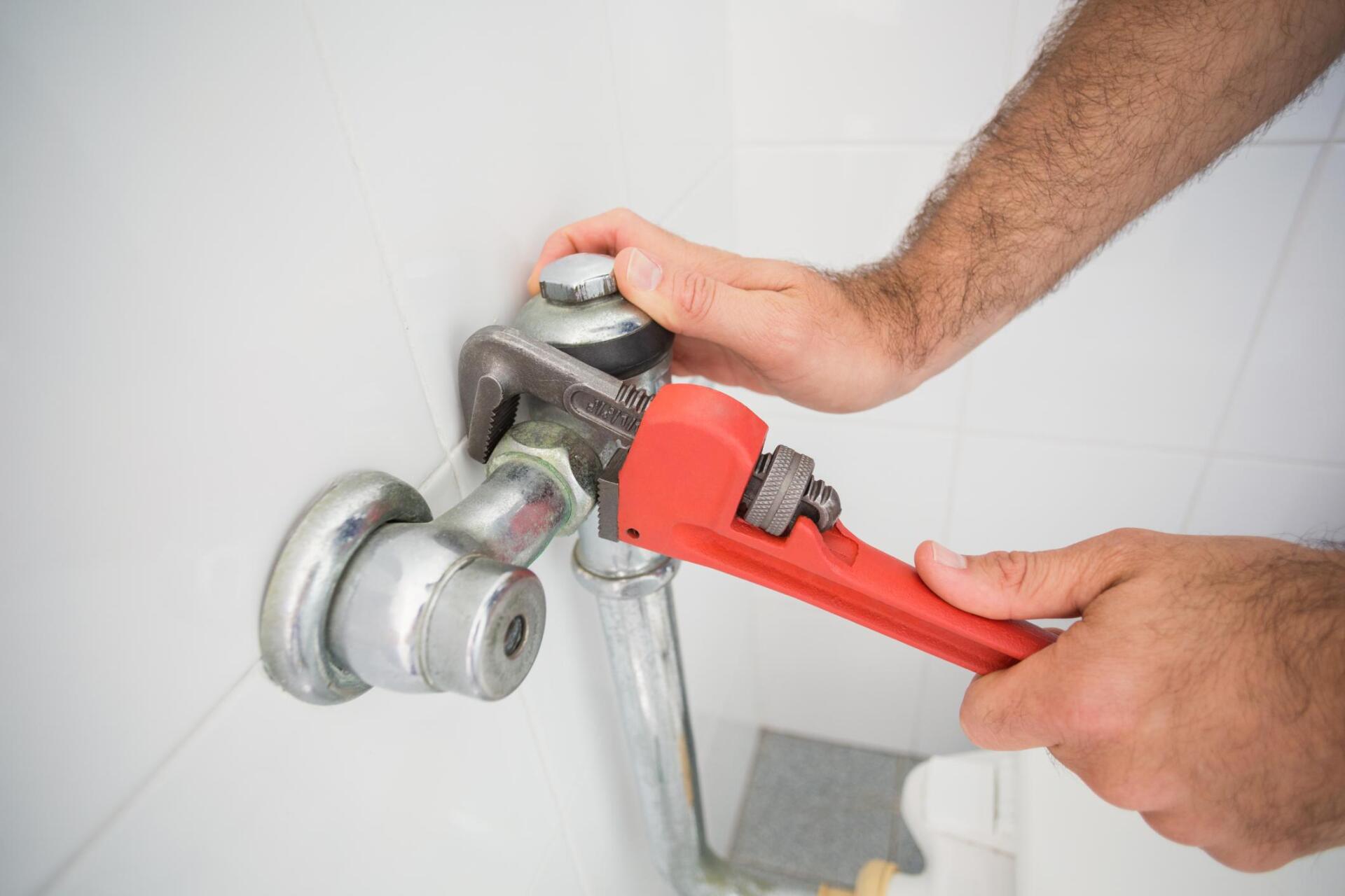 worker using the wrench