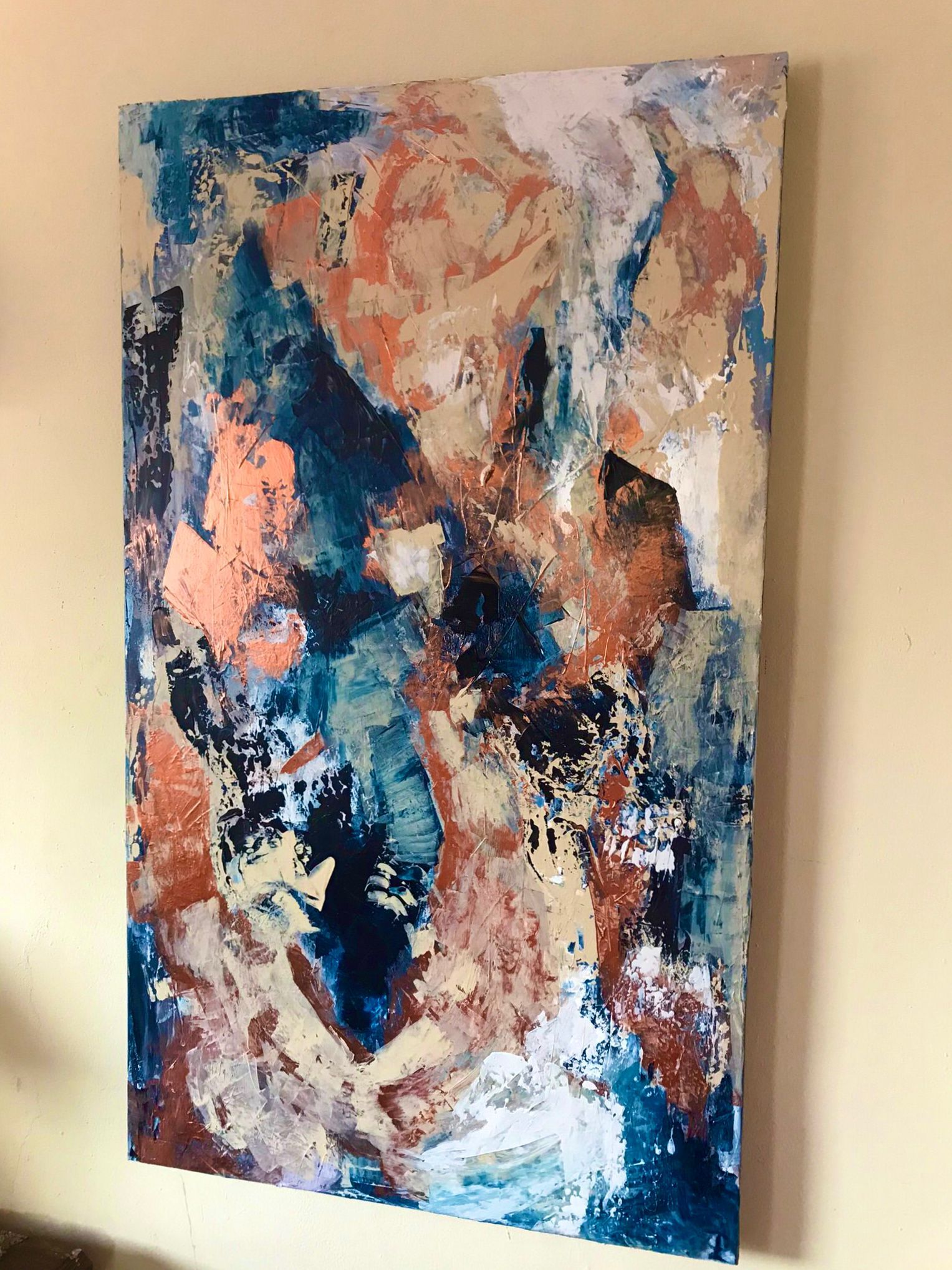 Abstract painting with blue, peach, white, and tan colors. Textured brushstrokes on a rectangular canvas.