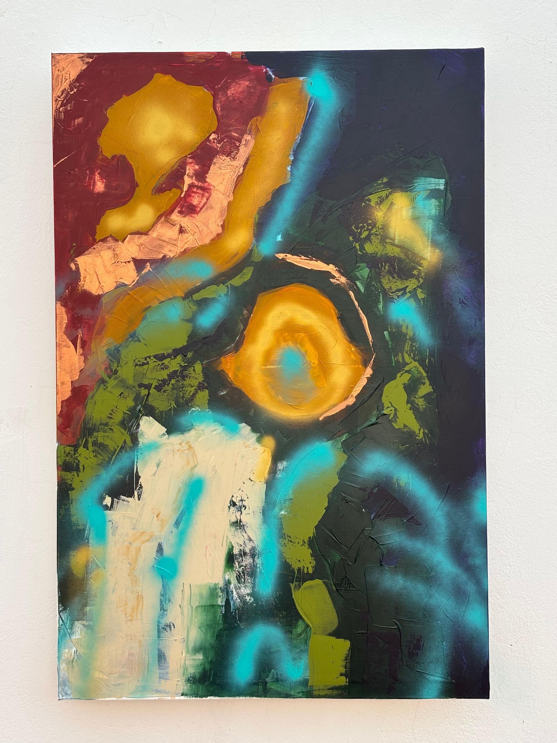 Abstract painting with a dark background, a golden circle, and turquoise spray paint.