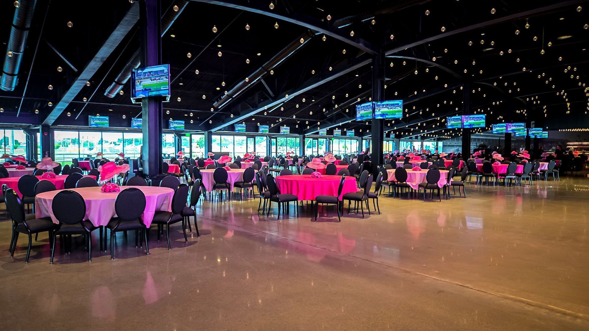 First Turn Club reception with track-view glass walls at Churchill Downs, Louisville