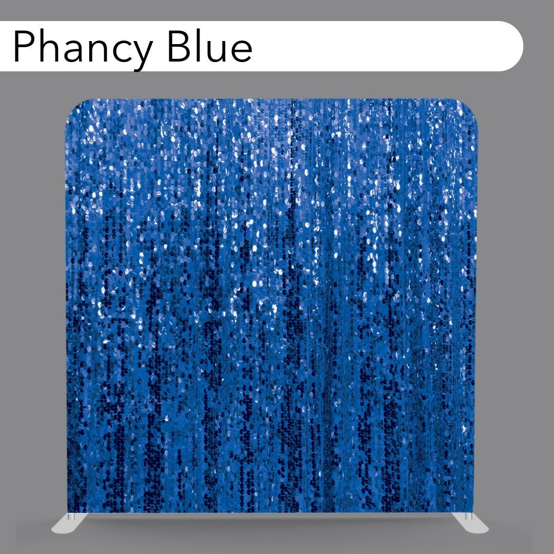 Blue glittery sequin fabric swatch labeled “Phancy Blue” on a gray background