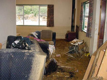 A living room with a couch and chairs in it