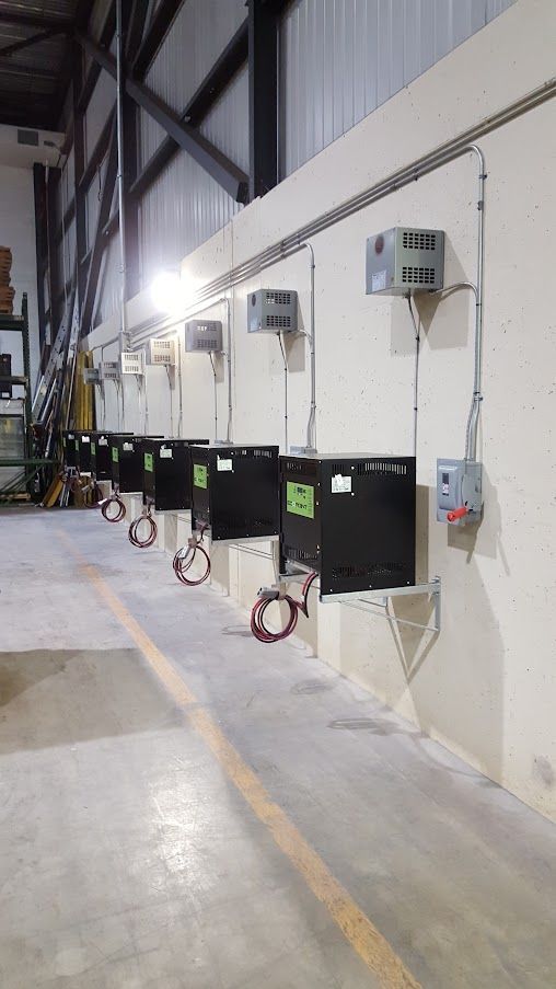 A warehouse with a lot of electrical equipment on the wall.