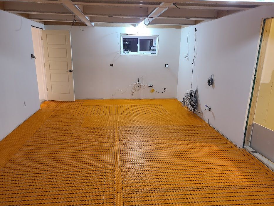 A room with a yellow floor and white walls.