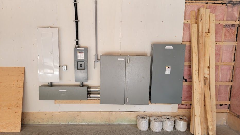 A room with a lot of electrical boxes on the wall