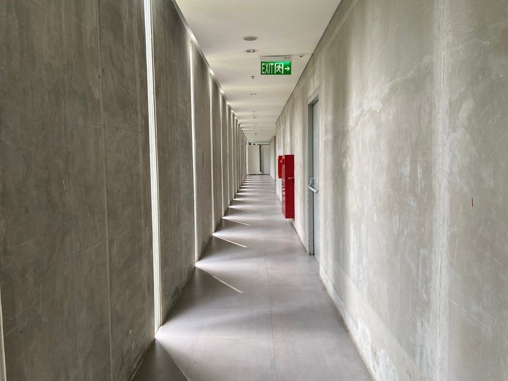 A Gray Hallway with Doors — Test Right Services in Townsville, QLD