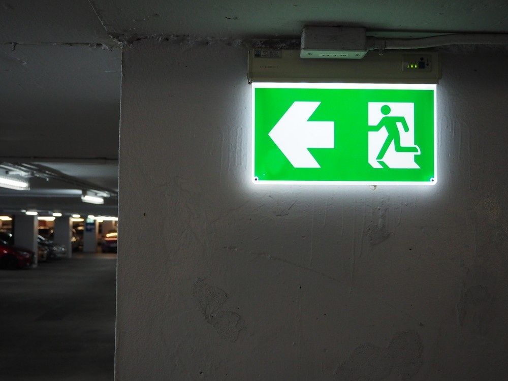 A Green Illuminated Emergency Exit — Test Right Services in Charters Towers, QLD