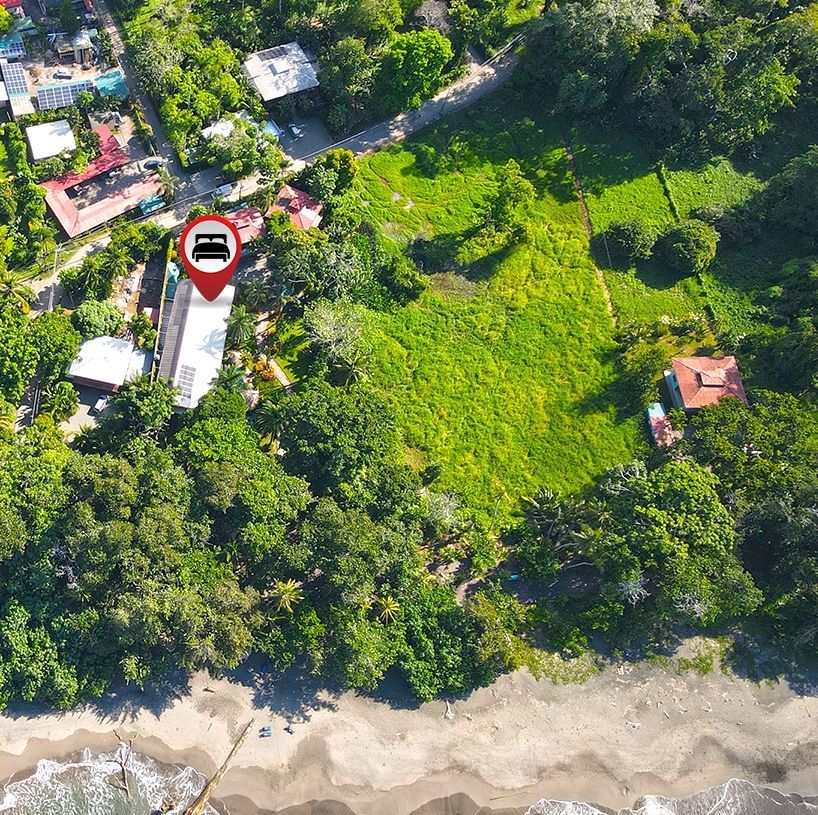 An aerial view of a lush green field with a bus in a red circle