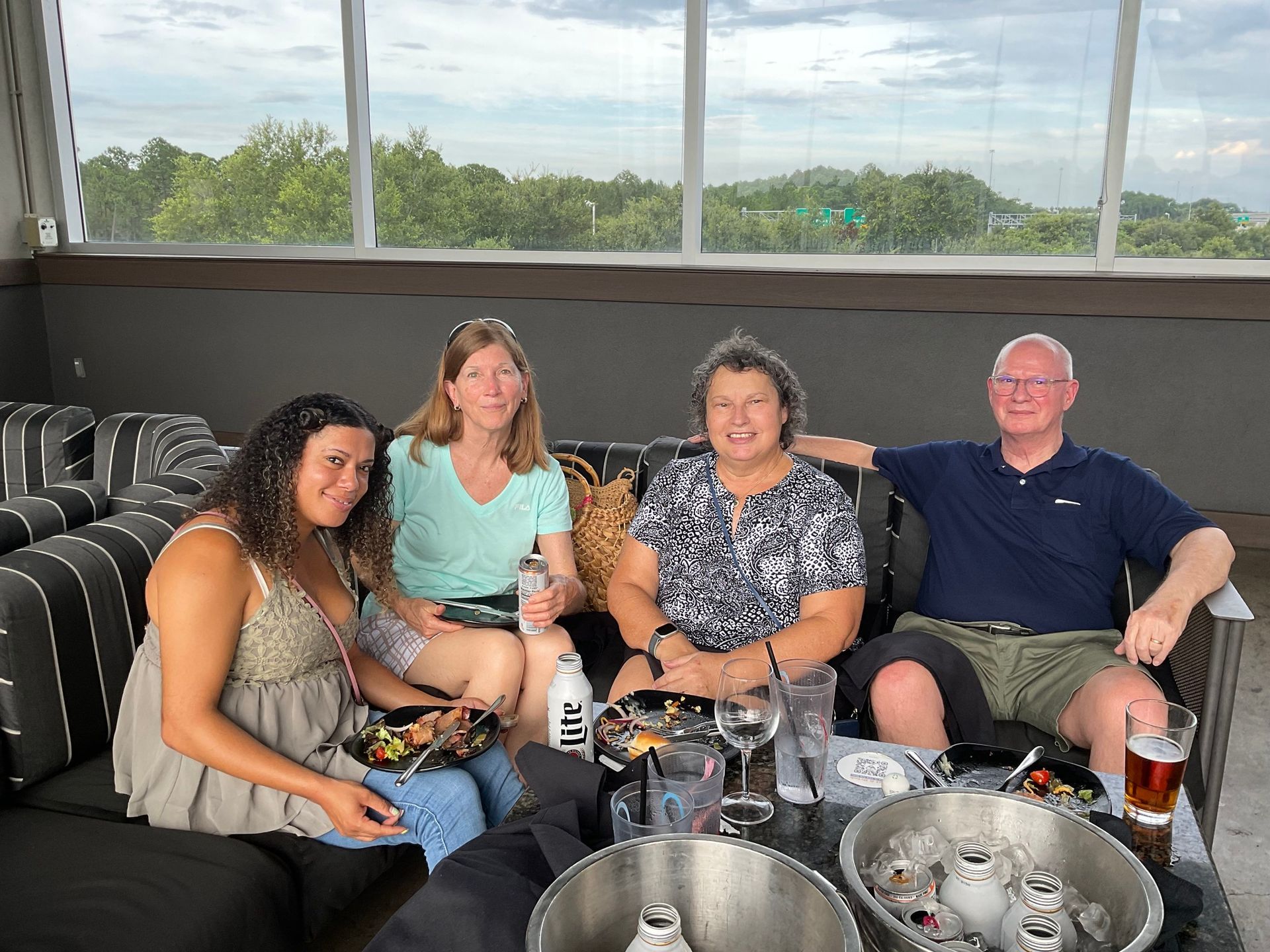 A group of people are sitting on a couch.